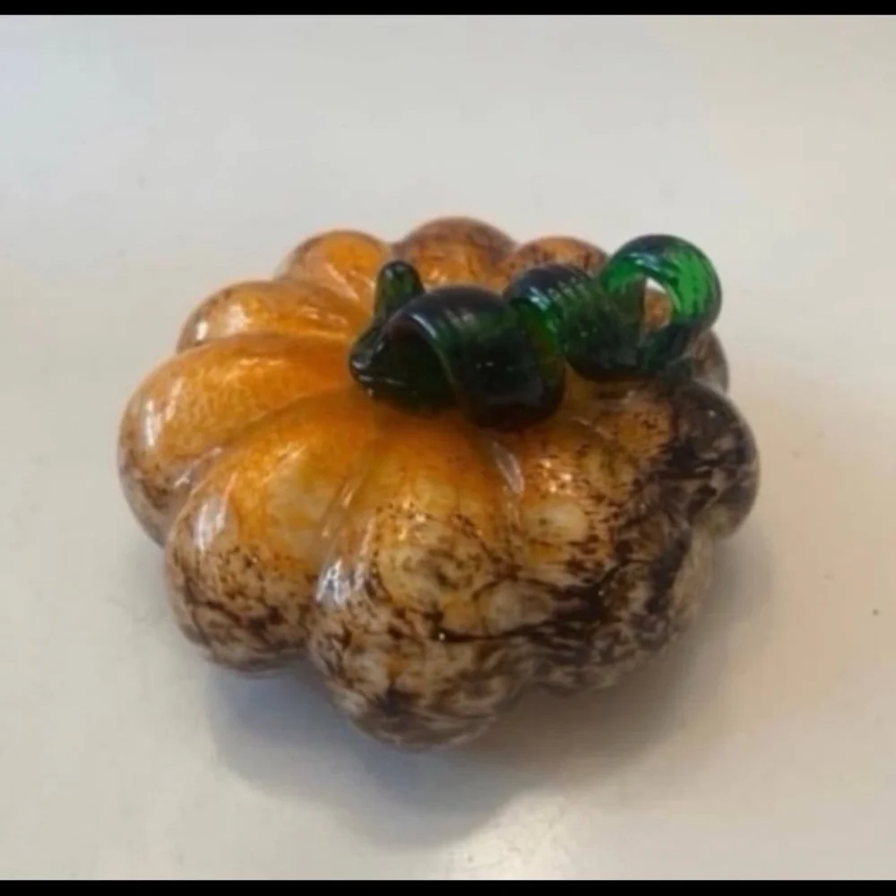Orange and brown glass pumpkin with green stem